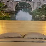 & Arch Mostar